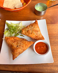 Crispy samosas with mint and tamarind chutneys